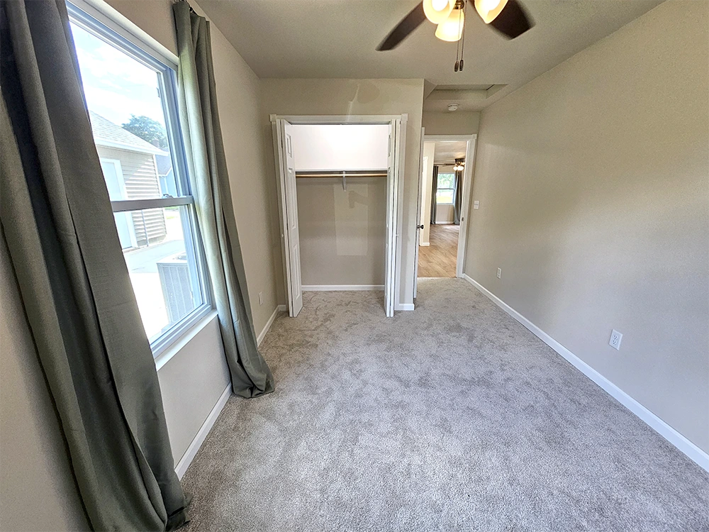 Includes a lighted closet with versatile storage - perfect for a second bedroom, guest space, or office.