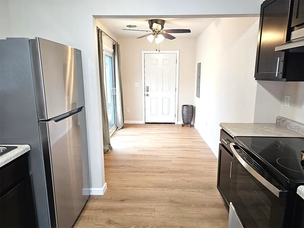 This is the back entryway which leads out to the spacious private patio, garage, and driveway.